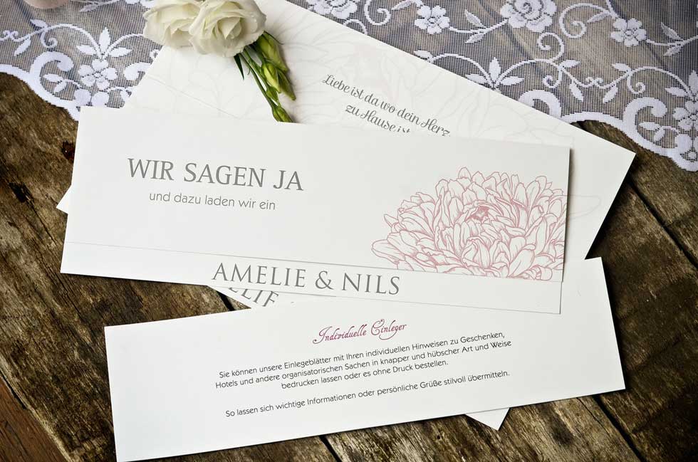 Einladung-zur-Hochzeit-mit-stilisierten-Blumen-in-Rosa-Amelie-und-Nils-carinokarten